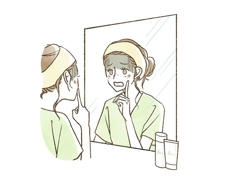 しみやそばかすができてショックを受ける女性のイラスト