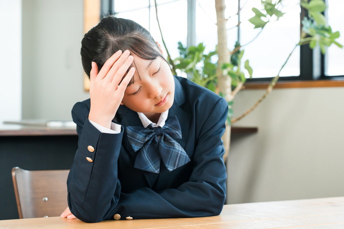 風邪をひいている学生
